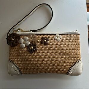 COACH Floral leather and straw wristlet with studs